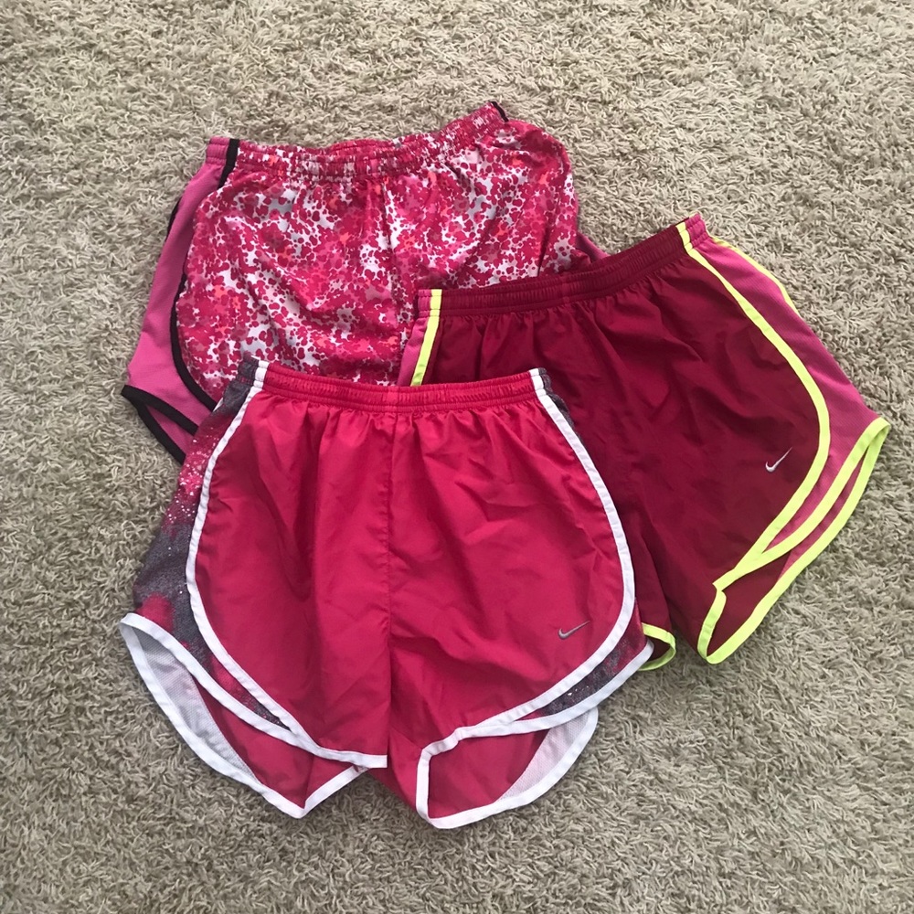 THREE pairs of size small nike shorts.